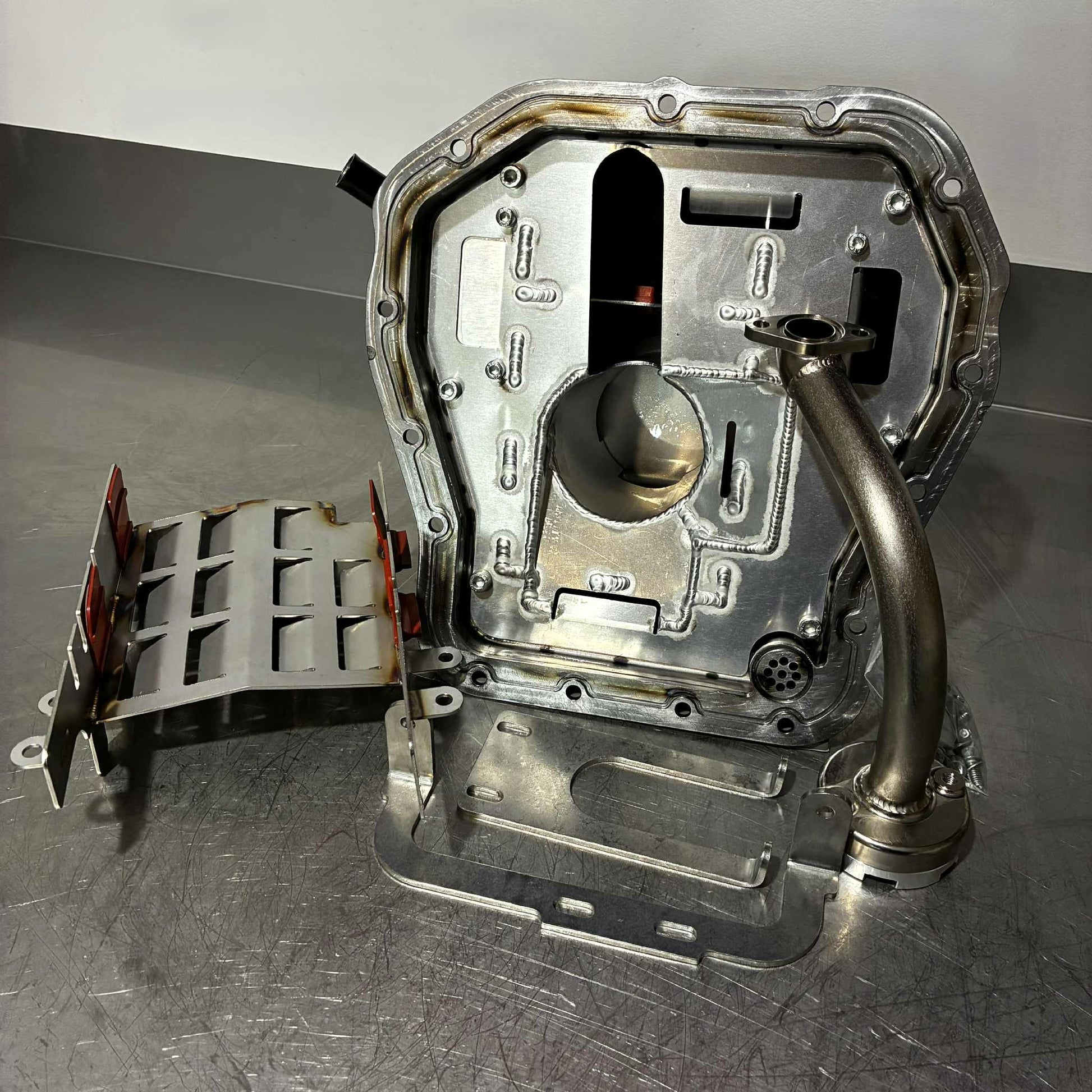 RSD Rallysport Design High Capacity Rally Racer Subaru EJ Engine Baffled Oil Pan Sump made for the EJ20 and EJ25 Engine. Also the Anti Surge Windage Tray for the Subaru EJ20/EJ25 engine which helps with more baffling and crankcase ventilation. Our high flow motorsport oil pickup  